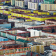 Illustration for article titled Worlds northernmost big city is a brutal mosaic of color and pollution